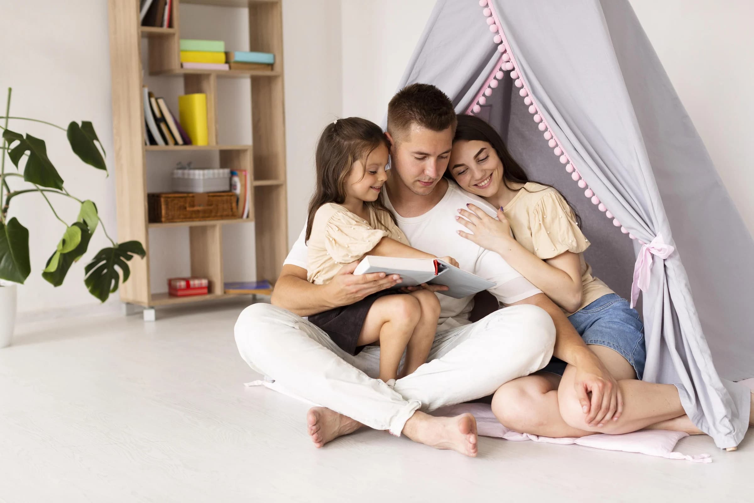 Parents reading with their child at home