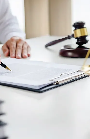 Legal documents and a gavel on a desk