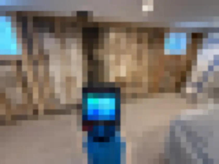 Thermal camera aimed at an exposed interior wall with wooden studs