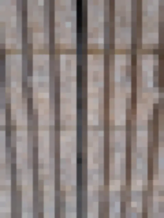 Close-up of rough, textured exterior building surface