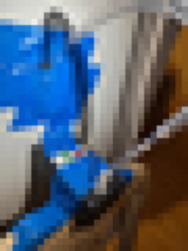 Photograph showing tubing and portable electronics attached with blue tape along staircase rail